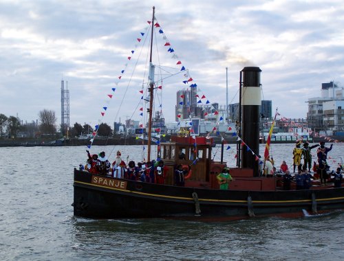 Sinterklaas and Zwarte Pieten arriving by steamboat in Vlaardingen (The Netherlands) in November 2006